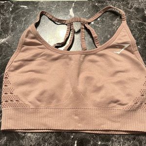 Gymshark set. Sports bra size medium and leggings are a size large. Khaki color.